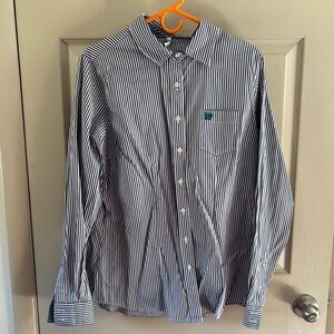 Striped button down shirt, with blue, purple, and white stripes.